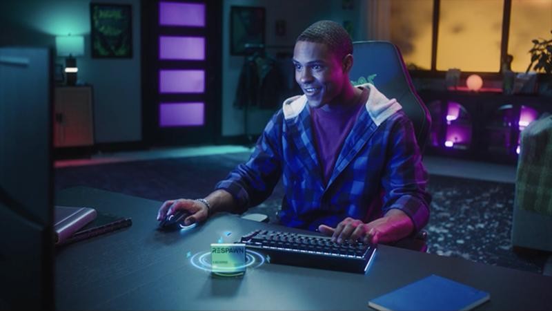 A gamer at his desk with a glowing Respawn pack
